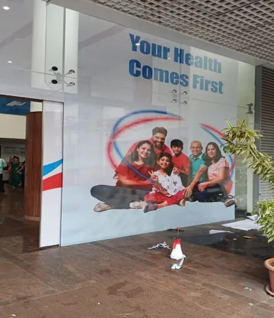 Hospital lobby wall carrying a large printed health message graphic